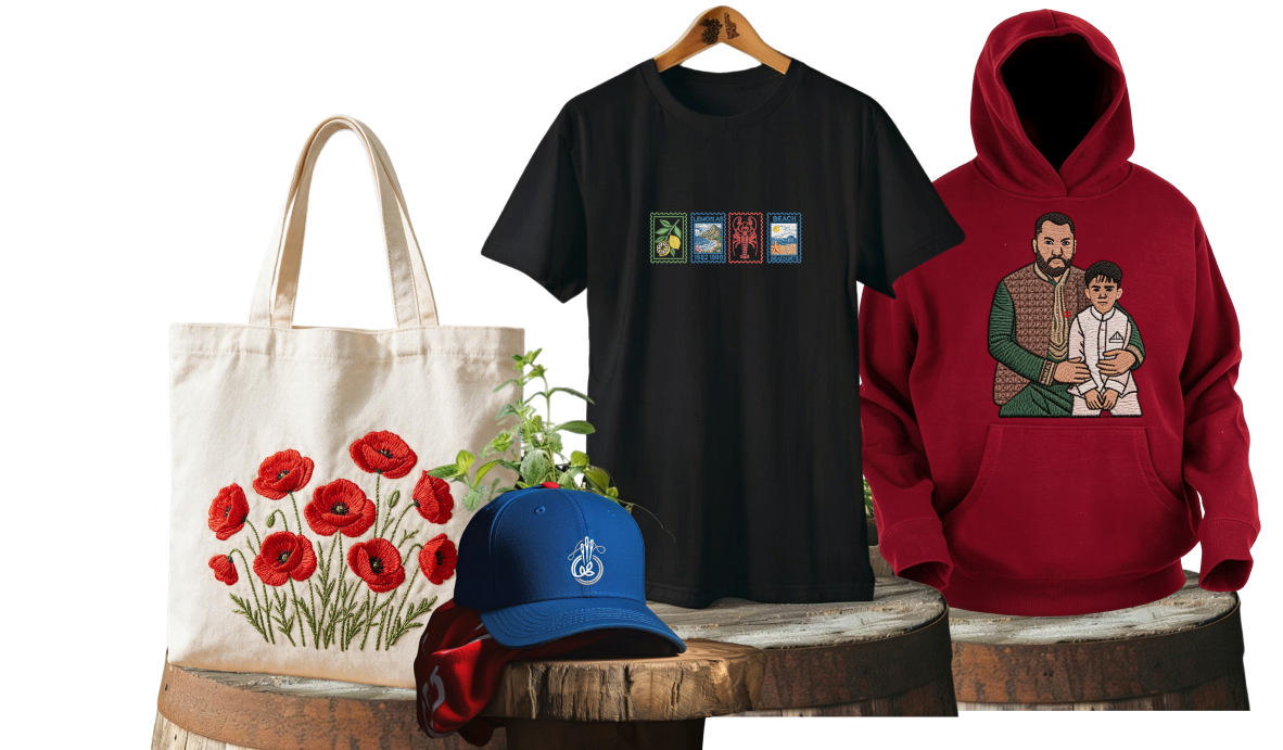 Personalized floral tote bag, embroidered blue cap, printed black T-shirt, and red hoodie on wooden display stands