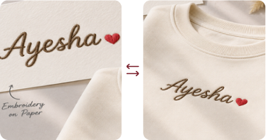 Ayesha lettering embroidered on a cream-colored shirt